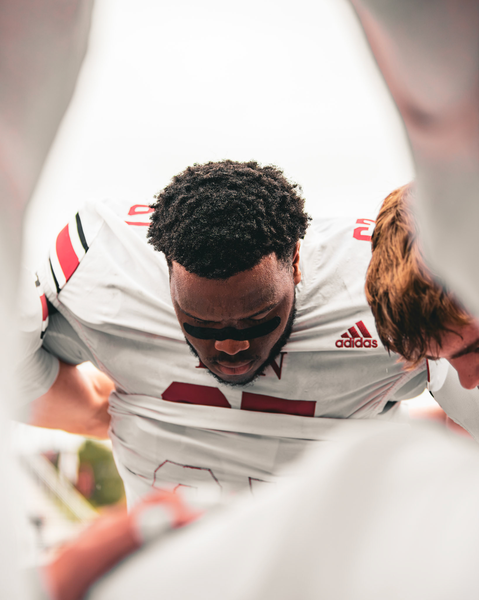 Football player in a huddle